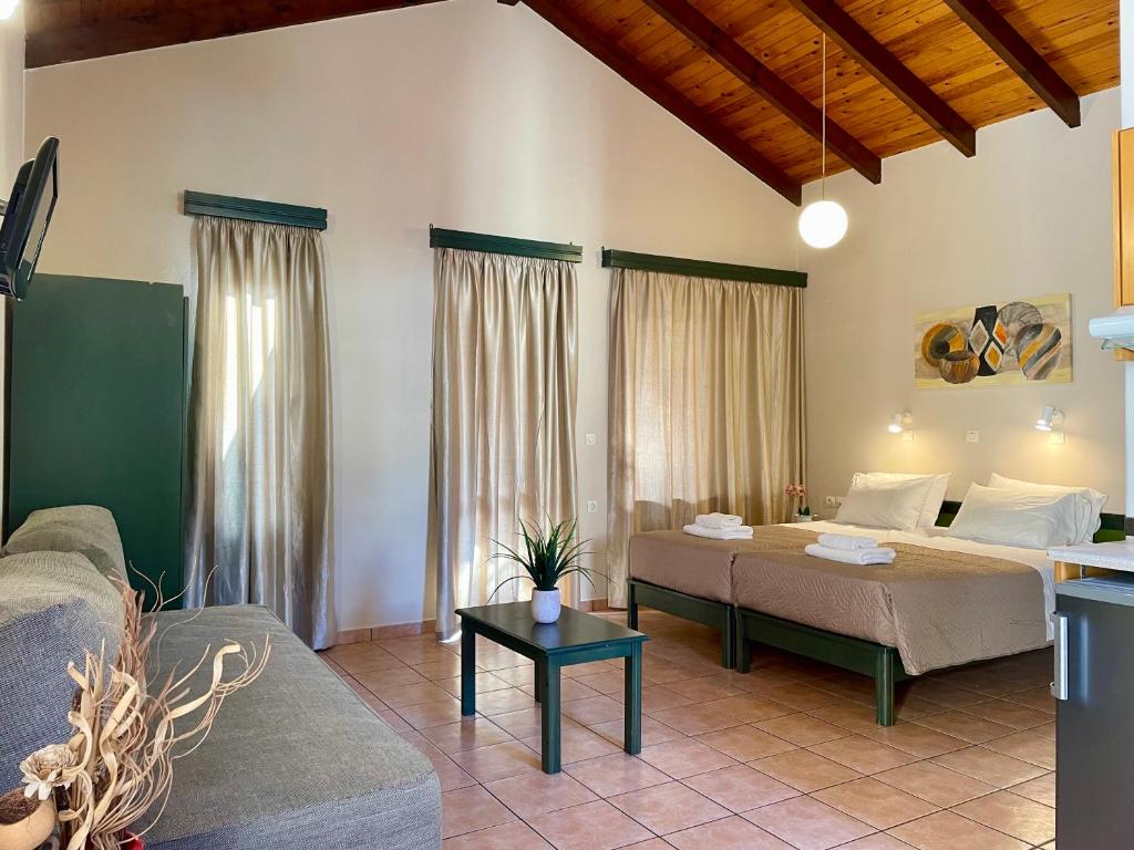 Posteľ alebo postele v izbe v ubytovaní Theos Holidays Apartments