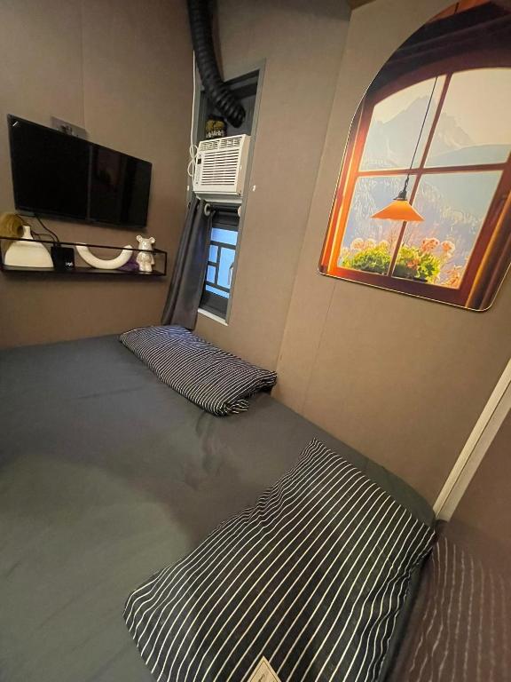 TV a/nebo společenská místnost v ubytování 榆迪賓館 YUTIK Guesthouse
