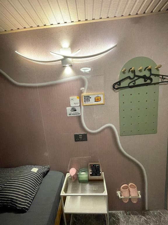 Postel nebo postele na pokoji v ubytování 榆迪賓館 YUTIK Guesthouse