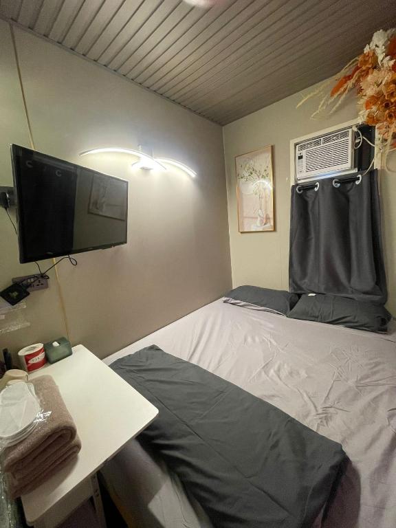 Postel nebo postele na pokoji v ubytování 榆迪賓館 YUTIK Guesthouse