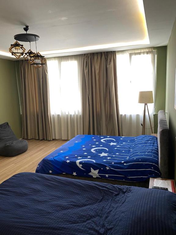 Postel nebo postele na pokoji v ubytování Driti Central Hotel