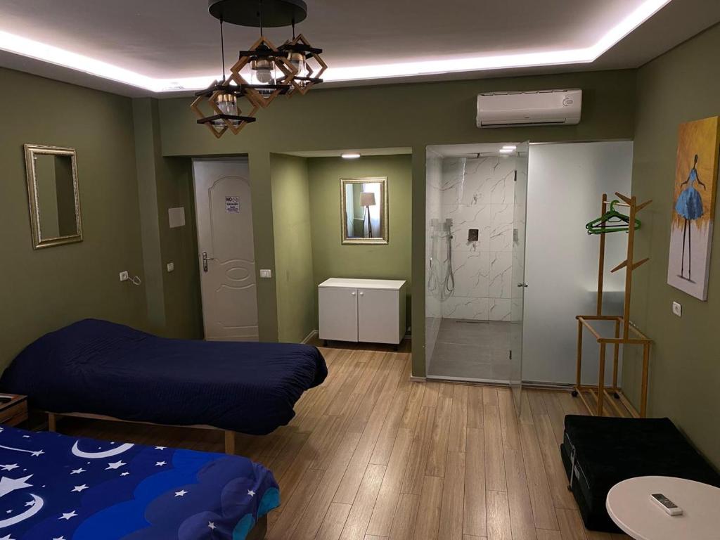 Postel nebo postele na pokoji v ubytování Driti Central Hotel