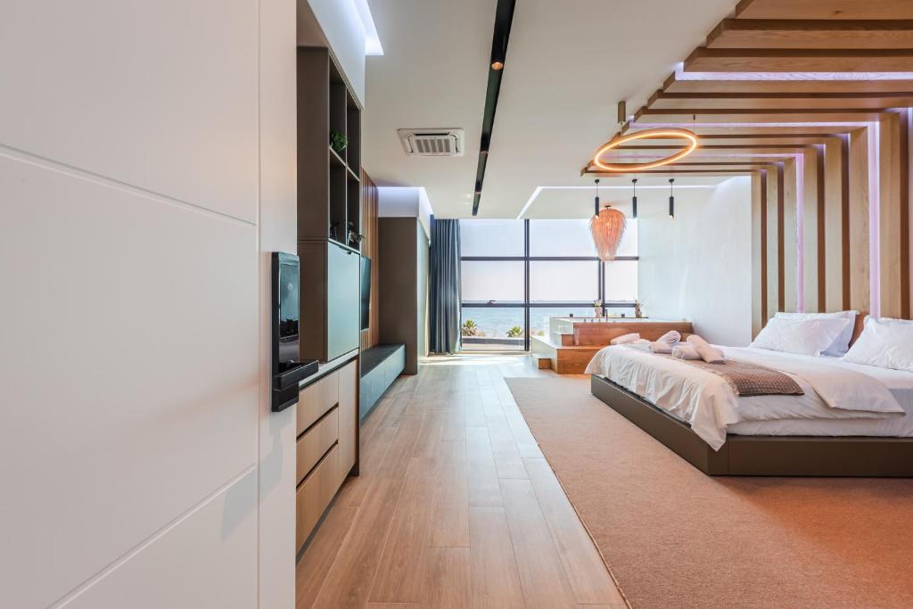 Postel nebo postele na pokoji v ubytování Marina Luxury Suites by PS