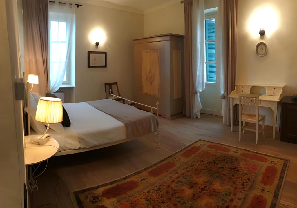 Postel nebo postele na pokoji v ubytování Il Castello di Bubbio