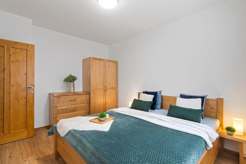 Ένα ή περισσότερα κρεβάτια σε δωμάτιο στο Špindl Lodge Apartments Self check-in & Sauna