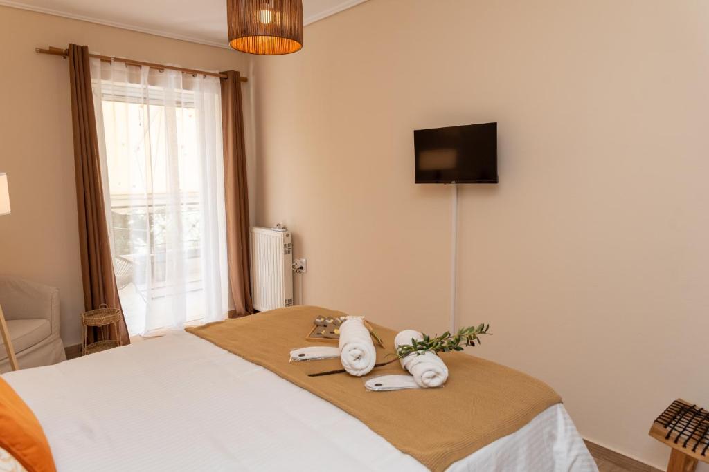 Postel nebo postele na pokoji v ubytování Athena Cocooning Apartment