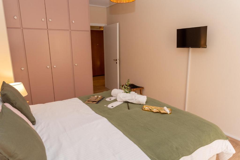 Postel nebo postele na pokoji v ubytování Athena Cocooning Apartment