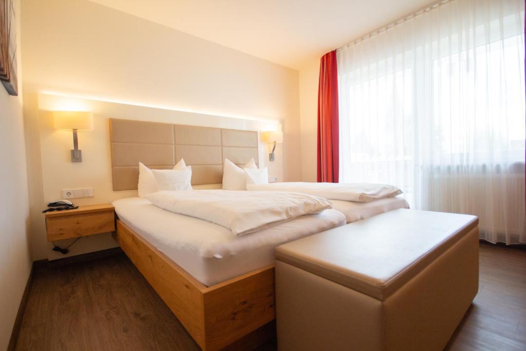 Postel nebo postele na pokoji v ubytování Hotel Lipprandt