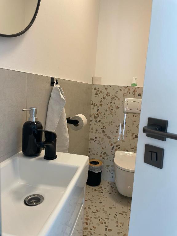 Koupelna v ubytování Klimatizovaný Apartmánový dom, s vírivkou, 1B