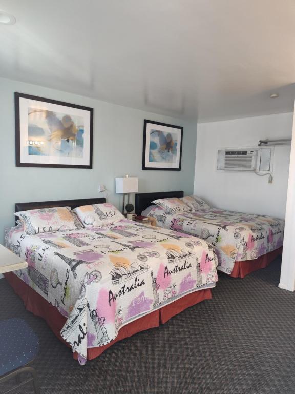 מיטה או מיטות בחדר ב-Colorado Inn Motel