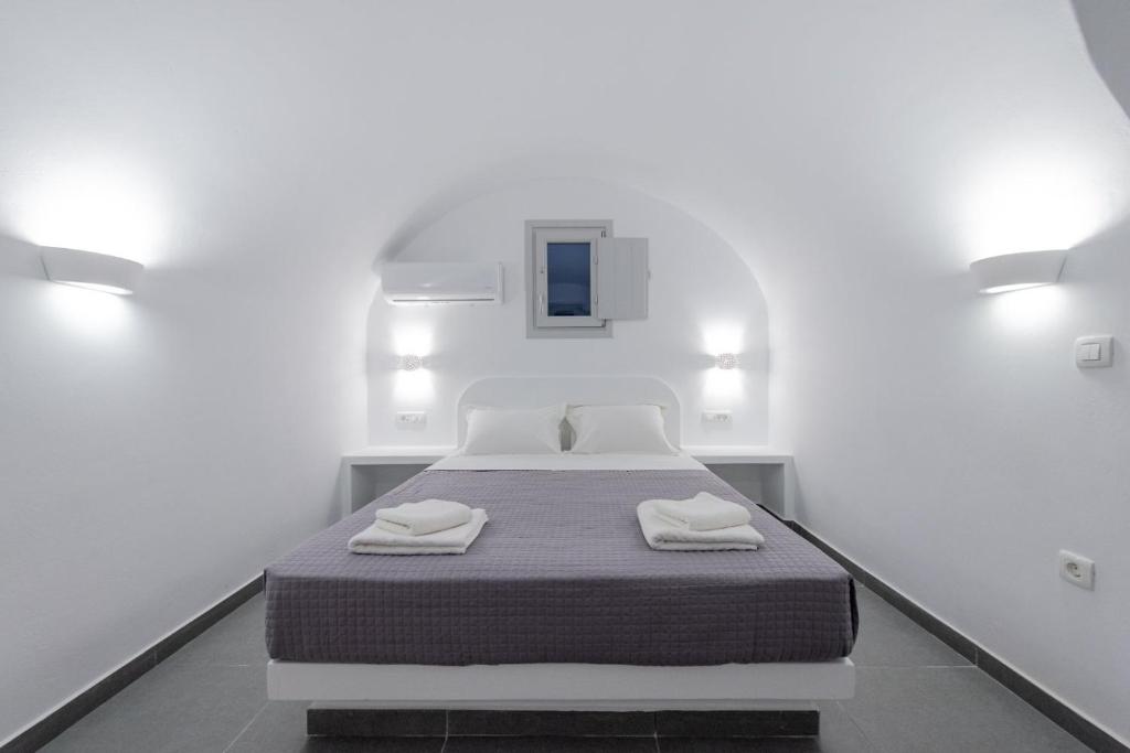 Postel nebo postele na pokoji v ubytování Golden View Suites