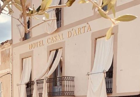 a hotelcial daria sign on the side of a building at Casal d'Artà by Baudot 1926 - Adults Only in Artá