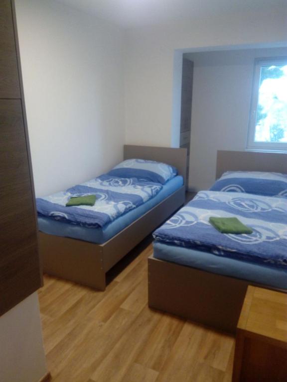 Postel nebo postele na pokoji v ubytování APARTMÁN PŘÍTLUKY - Zdeněk Bukovský