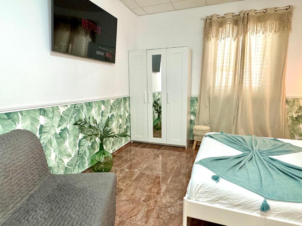 Televízia a/alebo spoločenská miestnosť v ubytovaní CASA SOLE - Apartamento Playa San Juan Nr. 2