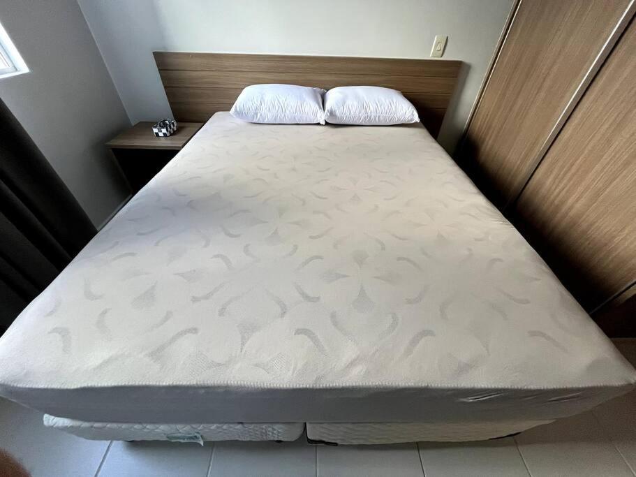 Postel nebo postele na pokoji v ubytování Flat 625 - Diferenciado com Ar no quarto e na sala