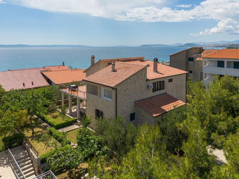 an aerial view of a house with the ocean behind it at Holiday Home Prančević in Podstrana