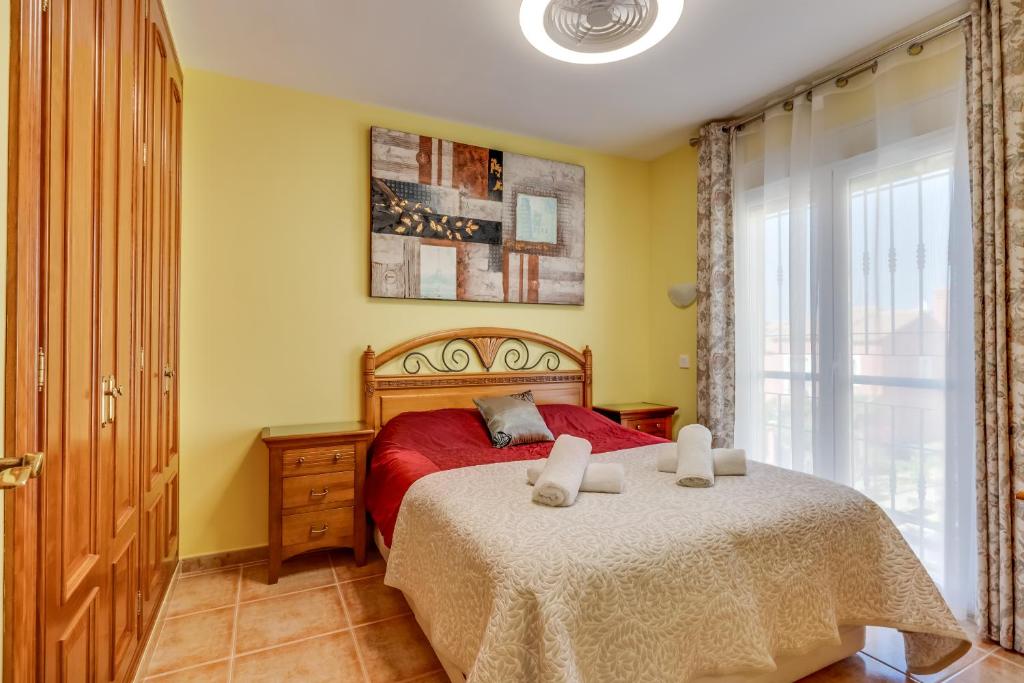 Łóżko lub łóżka w pokoju w obiekcie Casa Los Jarales