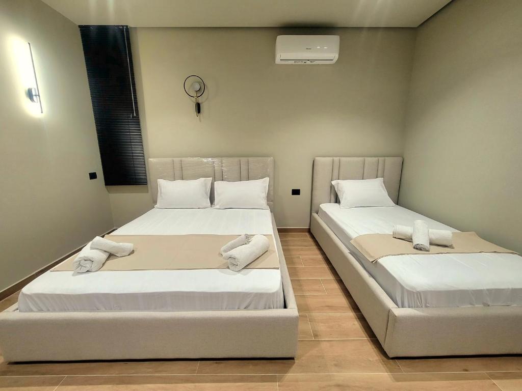 Postel nebo postele na pokoji v ubytování Geer Inn 3