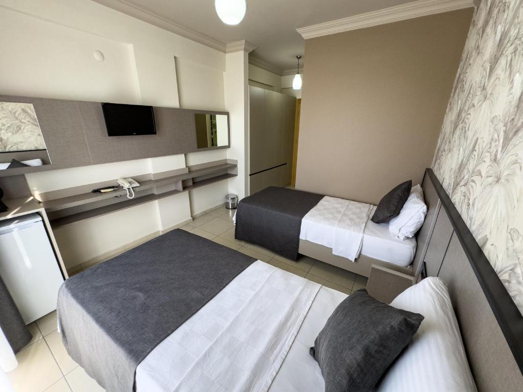 Postel nebo postele na pokoji v ubytování Sardunya Hotel
