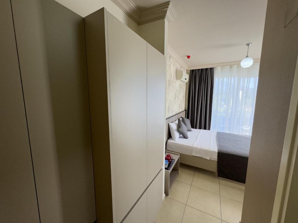 Postel nebo postele na pokoji v ubytování Sardunya Hotel