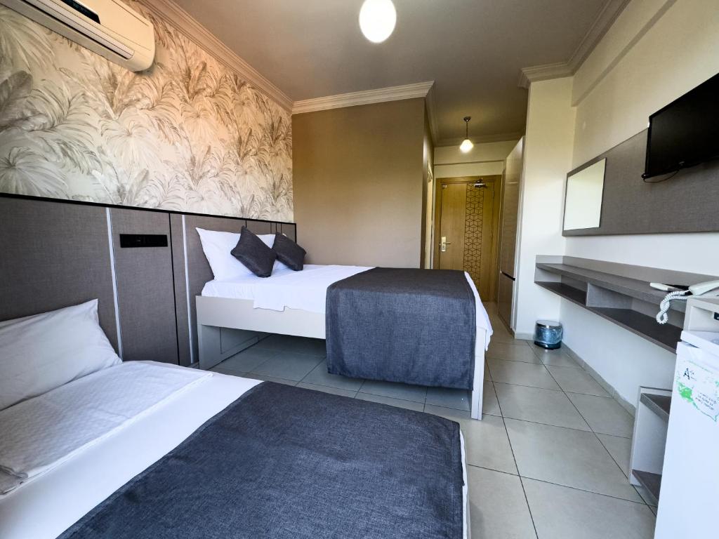 TV a/nebo společenská místnost v ubytování Sardunya Hotel