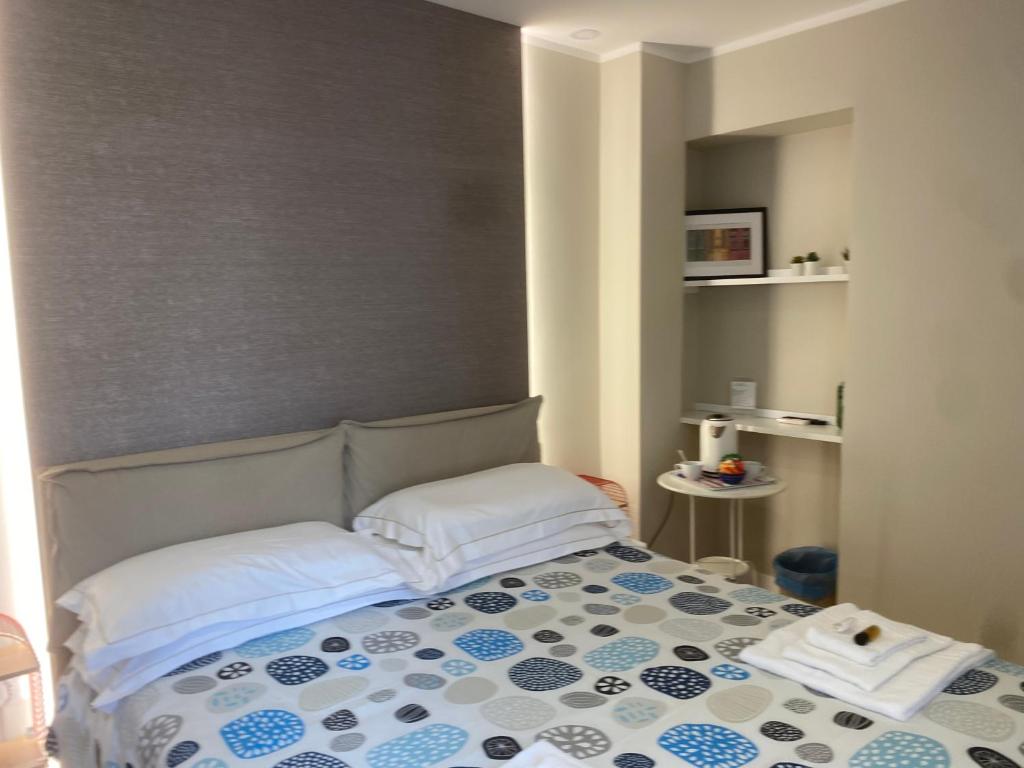 Postel nebo postele na pokoji v ubytování B&B Suite Cutelli