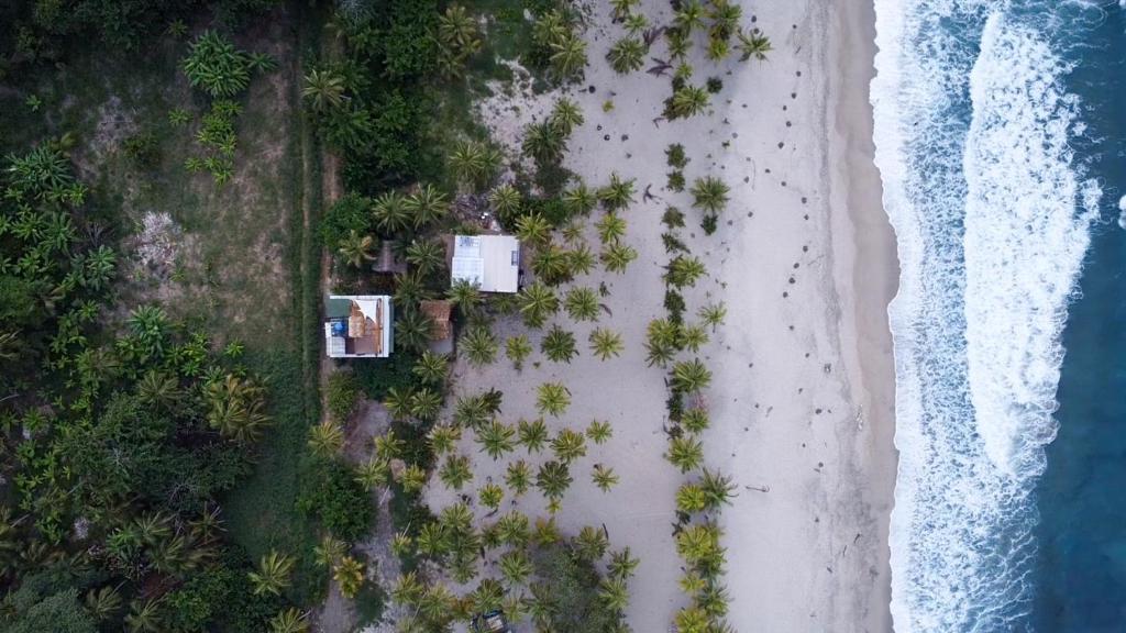 an overhead view of the beach and ocean at Natyva House in Guachaca