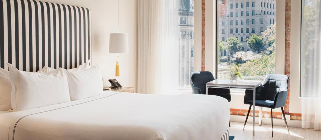 Postel nebo postele na pokoji v ubytování Monsieur Jean - Hôtel Particulier