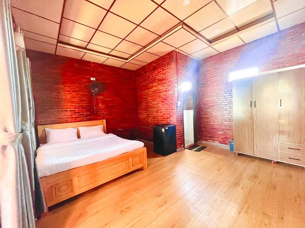 Postel nebo postele na pokoji v ubytování Bình Minh Homestay - Dốc Lết