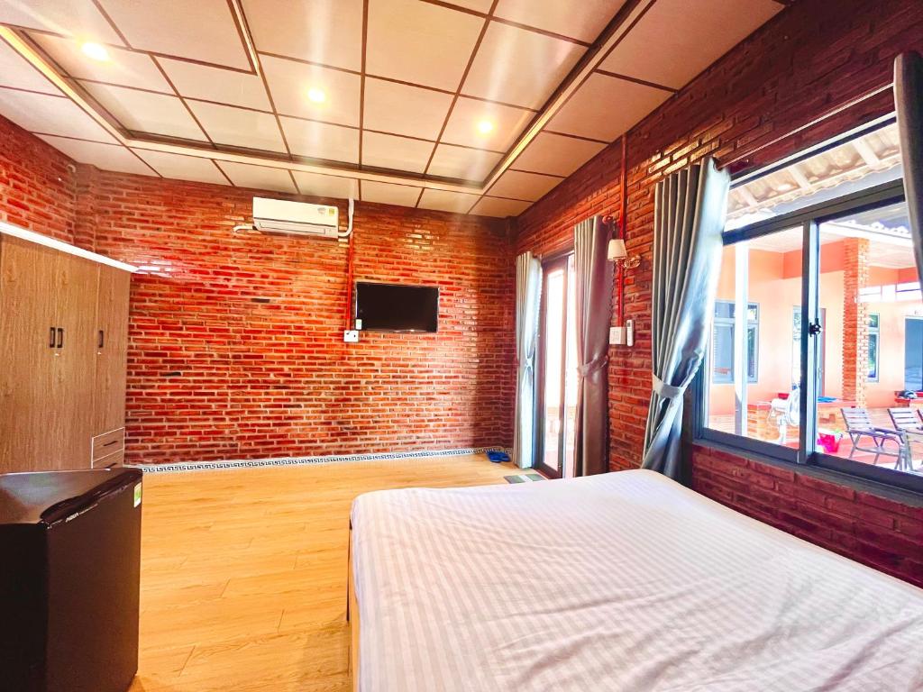 Postel nebo postele na pokoji v ubytování Bình Minh Homestay - Dốc Lết