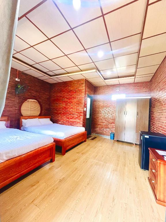 Postel nebo postele na pokoji v ubytování Bình Minh Homestay - Dốc Lết