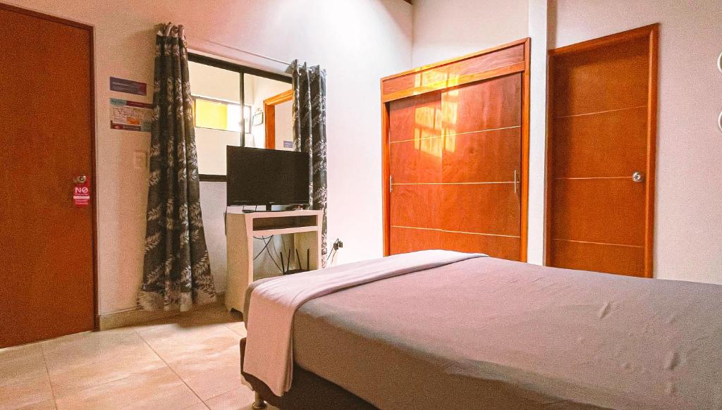 Postel nebo postele na pokoji v ubytování Malaika Hostel Medellín