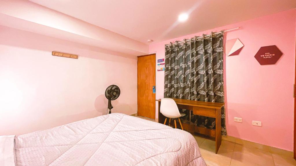 Postel nebo postele na pokoji v ubytování Malaika Hostel Medellín