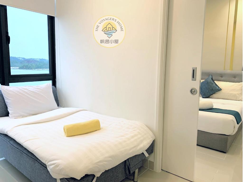 Postel nebo postele na pokoji v ubytování Sea Park LeSu 8 The Shore KK I 1 plus 1 Room 2-5 Pax 홈스테이