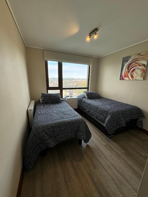 Postel nebo postele na pokoji v ubytování PuertoVarasC101