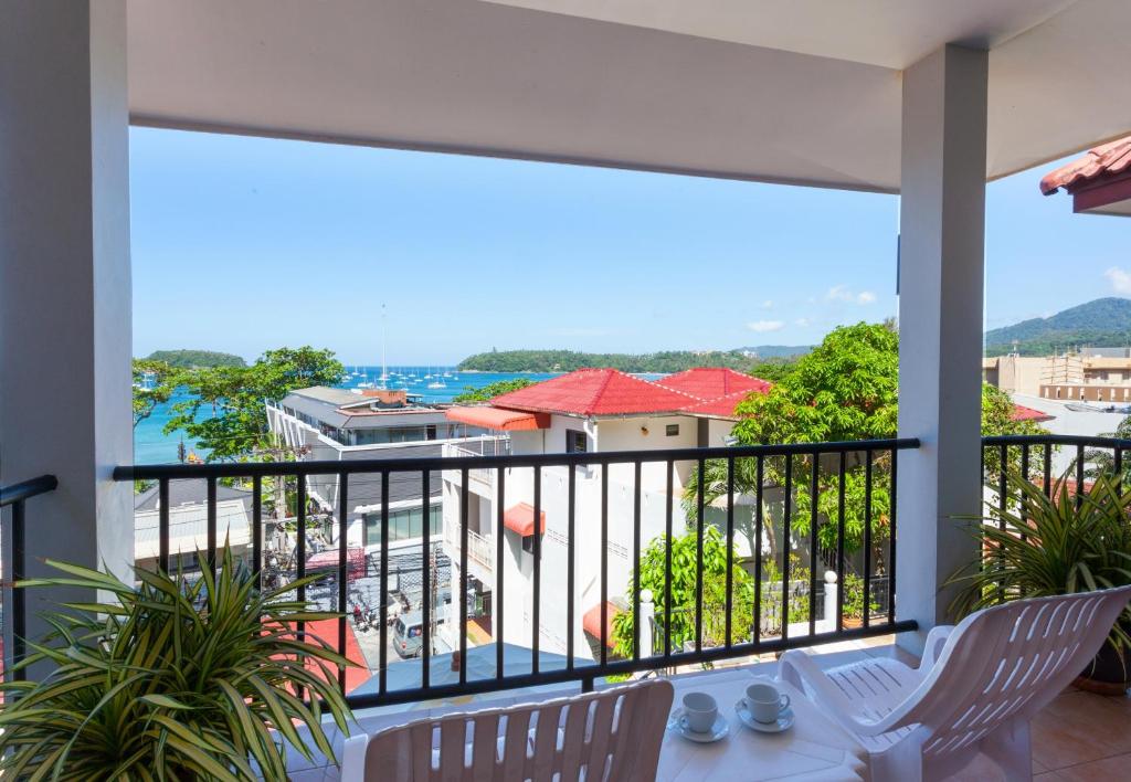 a balcony with a view of the ocean at Two Chefs Inn in Kata Beach