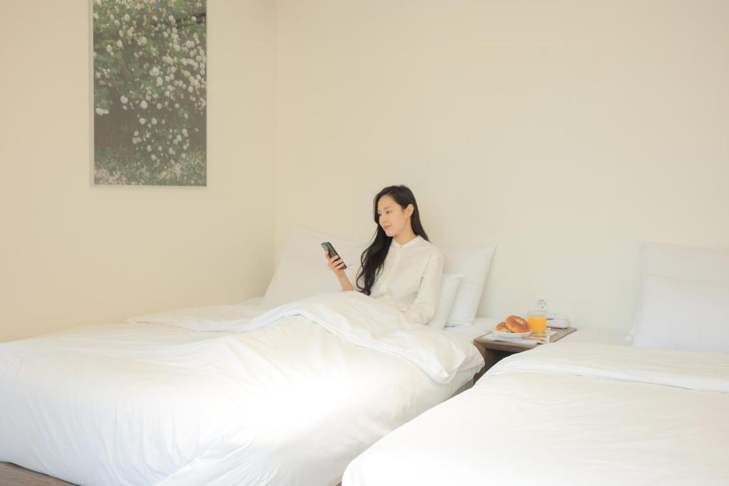Postel nebo postele na pokoji v ubytování Aank Hotel Wolgot