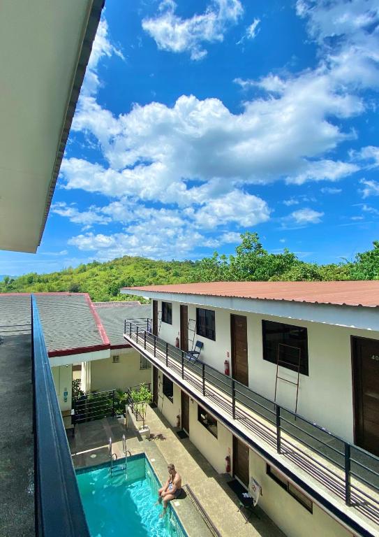 a view from the balcony of a building with a swimming pool at Vela Terraces Hotel in Coron