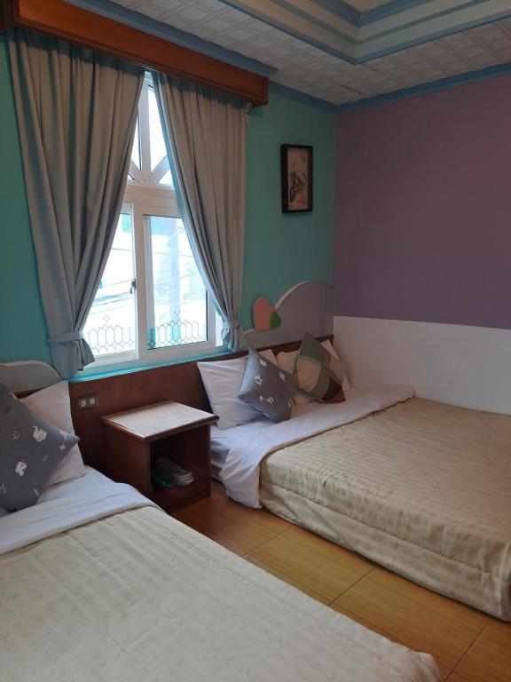 Postel nebo postele na pokoji v ubytování Heart Seed B&B