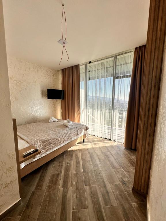 Postel nebo postele na pokoji v ubytování Green Cape Tower