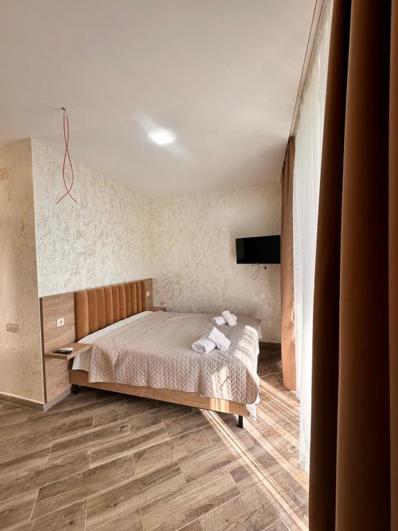 Ένα ή περισσότερα κρεβάτια σε δωμάτιο στο Green Cape Tower