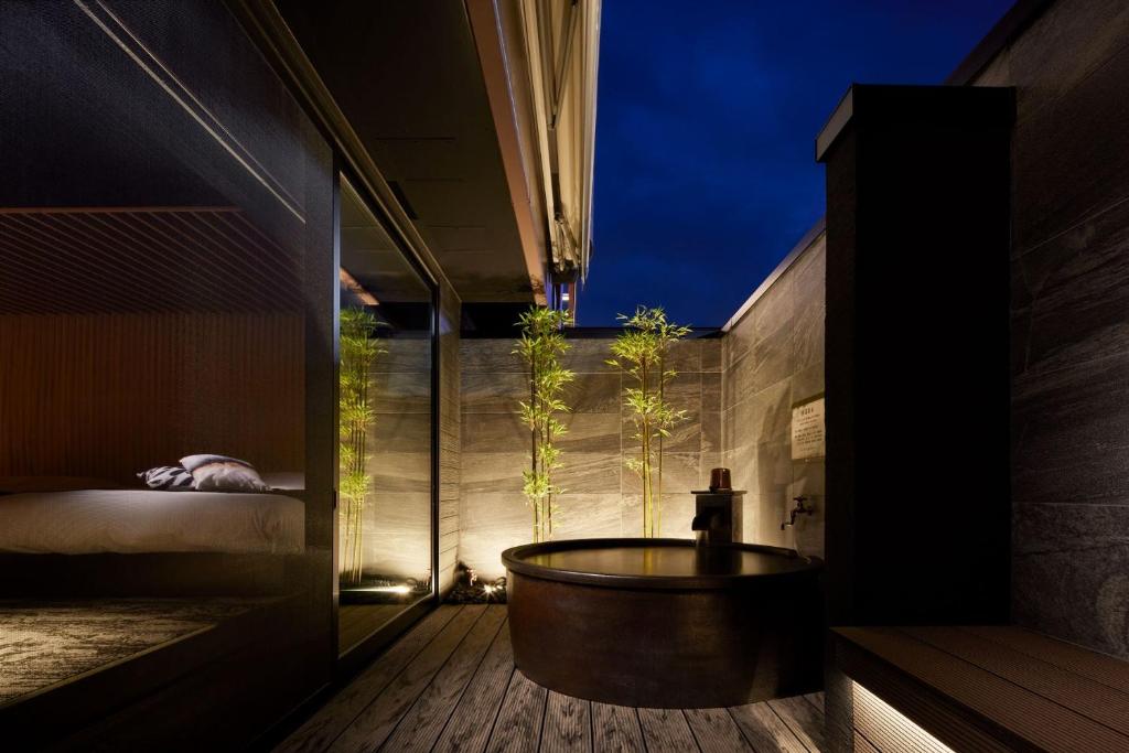 Postel nebo postele na pokoji v ubytování Yatomi Hotel Nuqu Natural Hot Spring