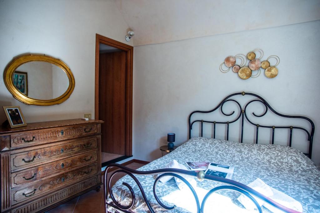 Łóżko lub łóżka w pokoju w obiekcie Casa di Lella - Happy Rentals
