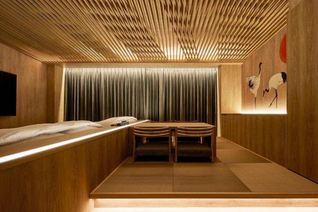 Postel nebo postele na pokoji v ubytování Yatomi Hotel Nuqu Natural Hot Spring