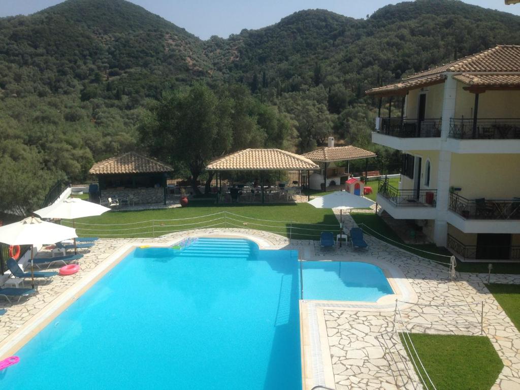 a view of a resort with a swimming pool at Villa Agni in Yenion