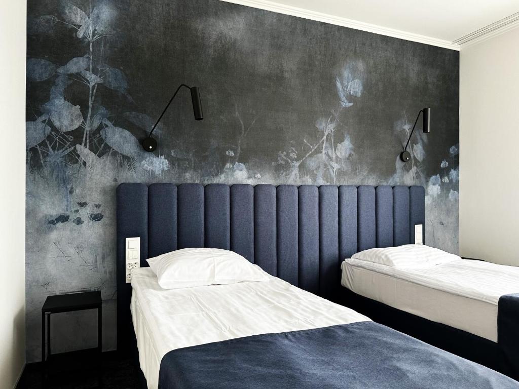 Posteľ alebo postele v izbe v ubytovaní Hotel Szydłowski