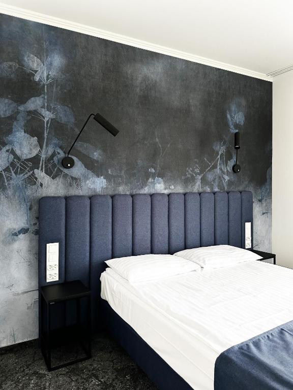 Posteľ alebo postele v izbe v ubytovaní Hotel Szydłowski