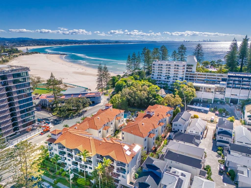 an aerial view of a city with a beach and buildings at Bella Mare Coolangatta Beachside Apartments in Gold Coast