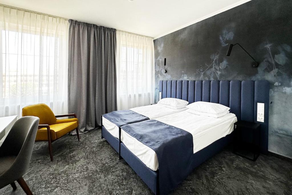 Posteľ alebo postele v izbe v ubytovaní Hotel Szydłowski