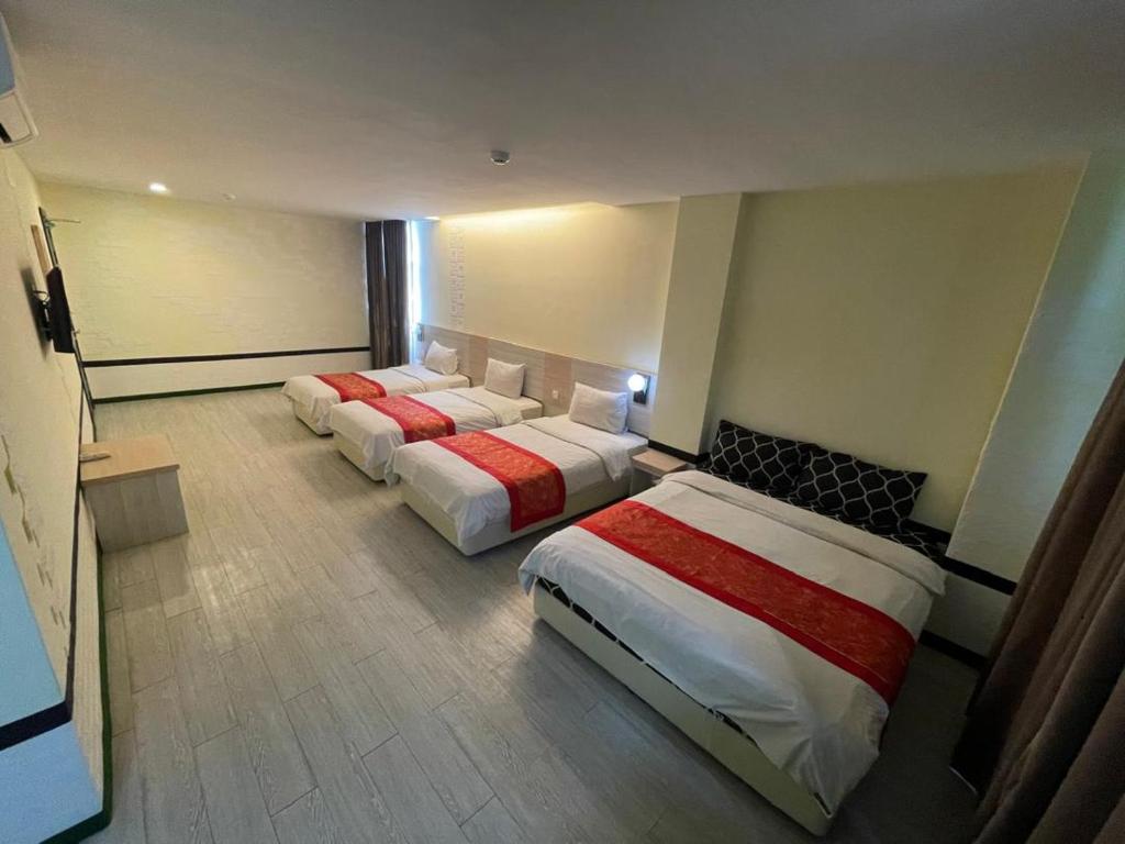 Postel nebo postele na pokoji v ubytování N&L HOTEL KUALA TERENGGANU